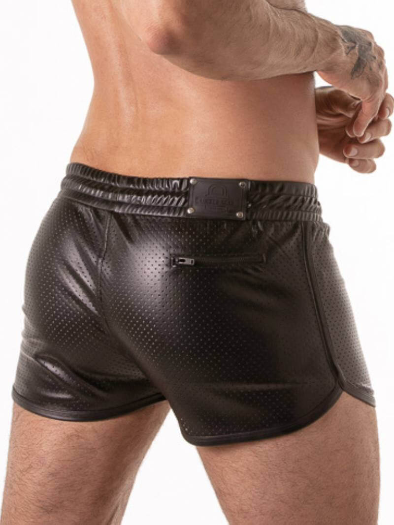 Black leather shorts with textured design worn by a person on a white background