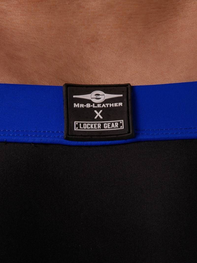 Blue belt with a black label on a brown leather background