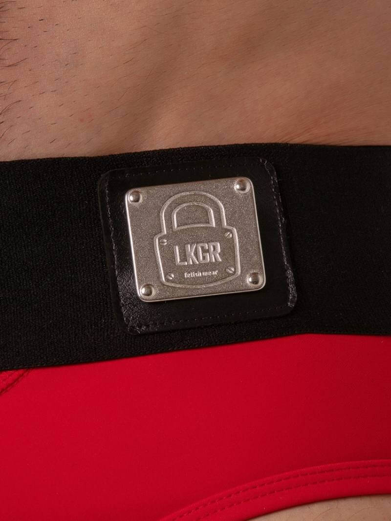 Black belt with a metal plaque labeled 'LKGR' on a red background