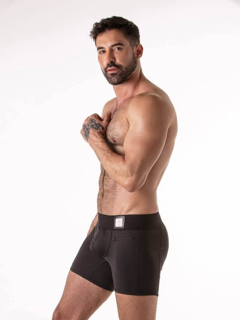 Man wearing black underwear on a white background