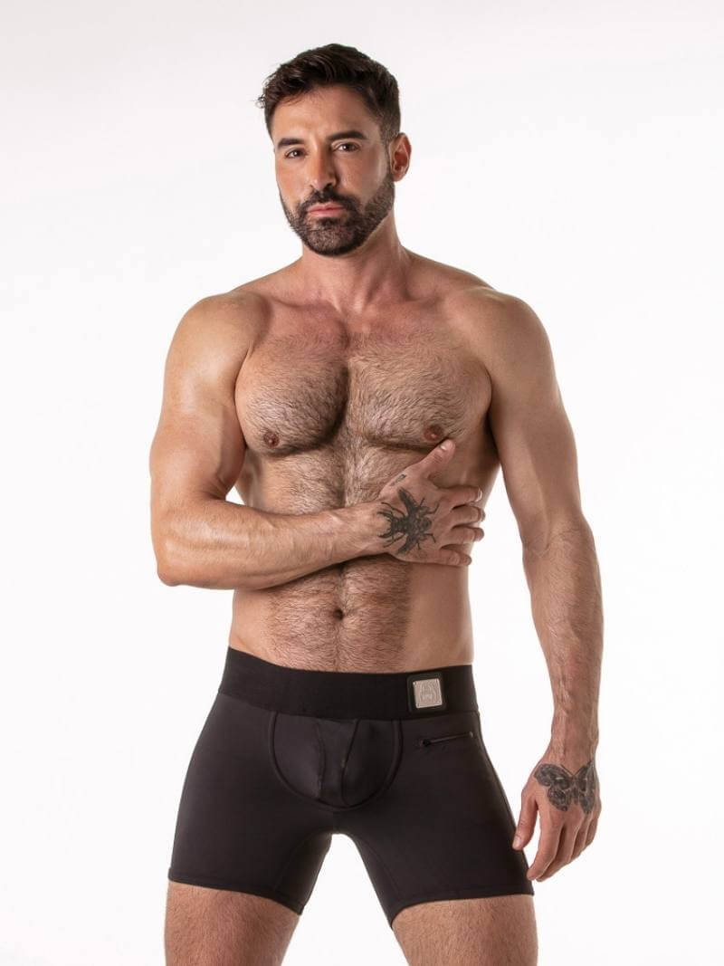 Man wearing black underwear on a white background