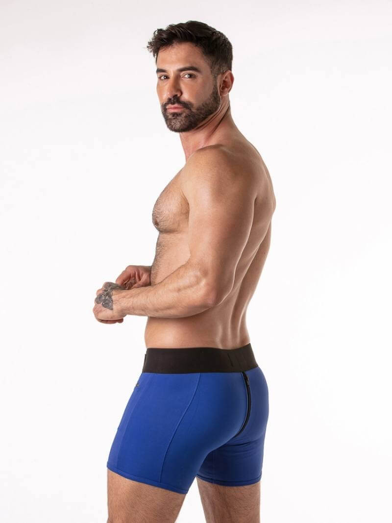 Man wearing blue underwear with a white background