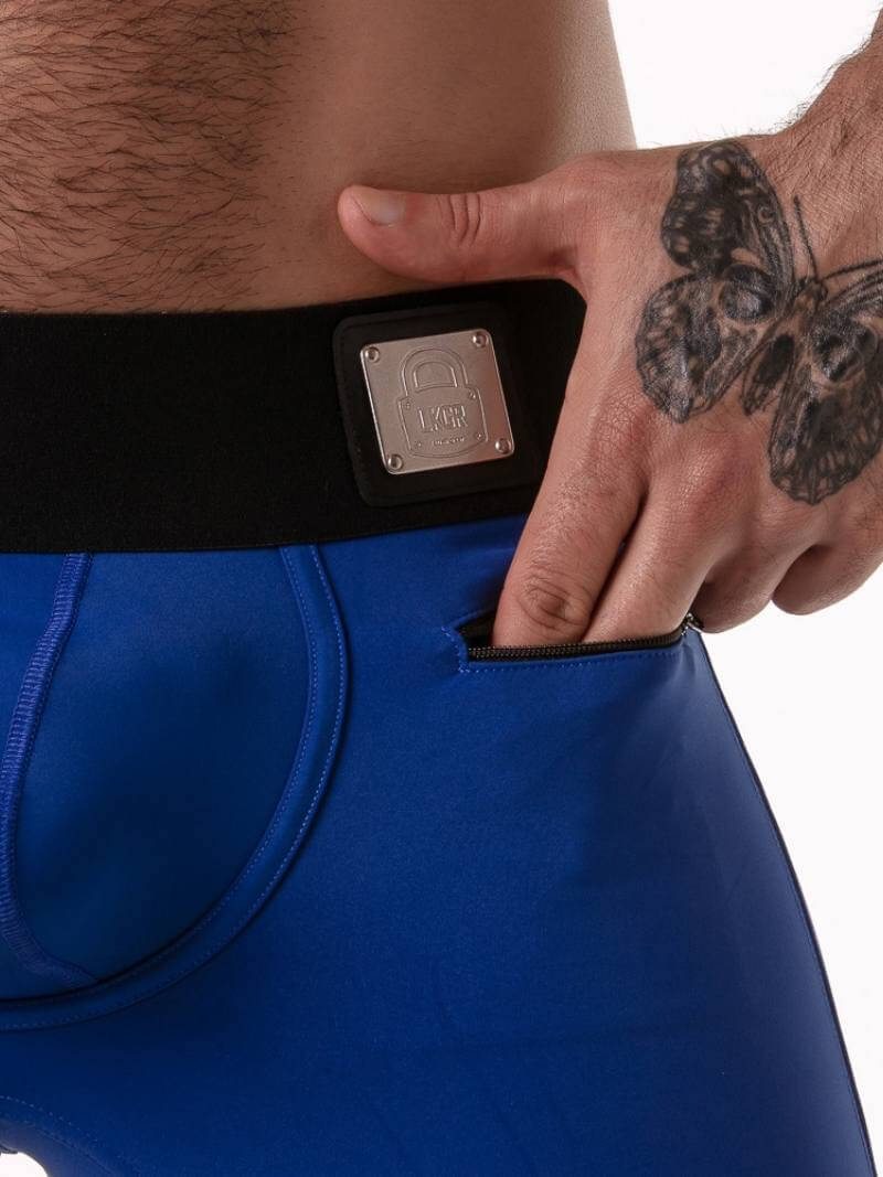Person wearing a blue athletic outfit with a black waist trainer, showing a close-up of the waist trainer.