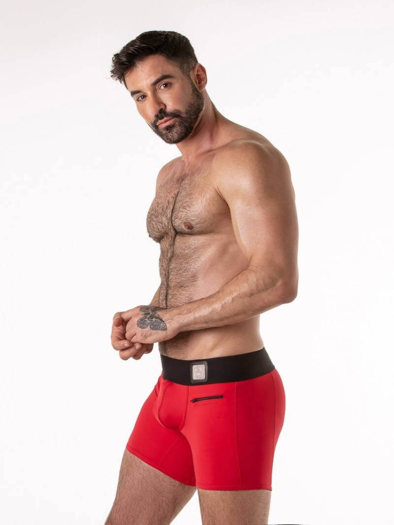 Man wearing red gay boxer briefs on a white background