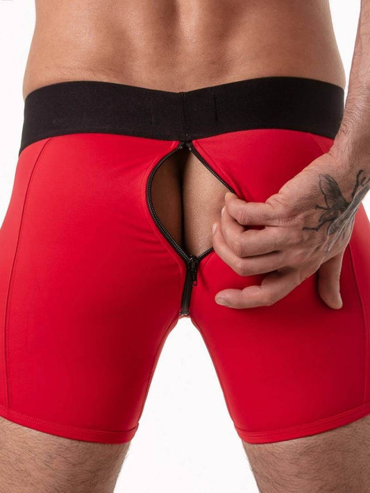 Red athletic shorts with a black waistband on a white background