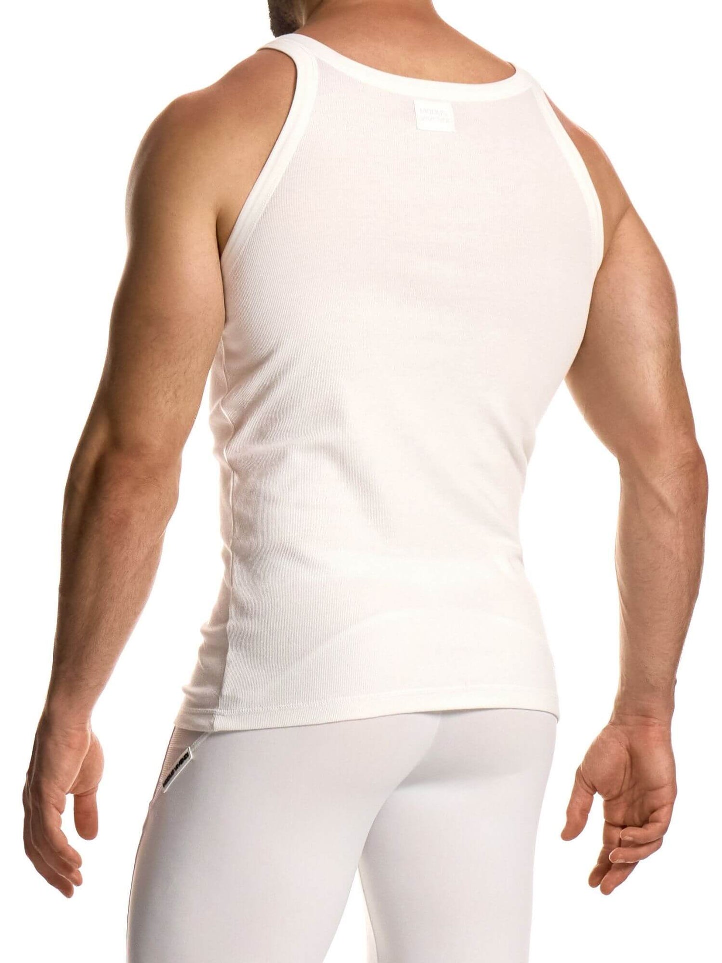 Person wearing a white tank top and pants on a white background
