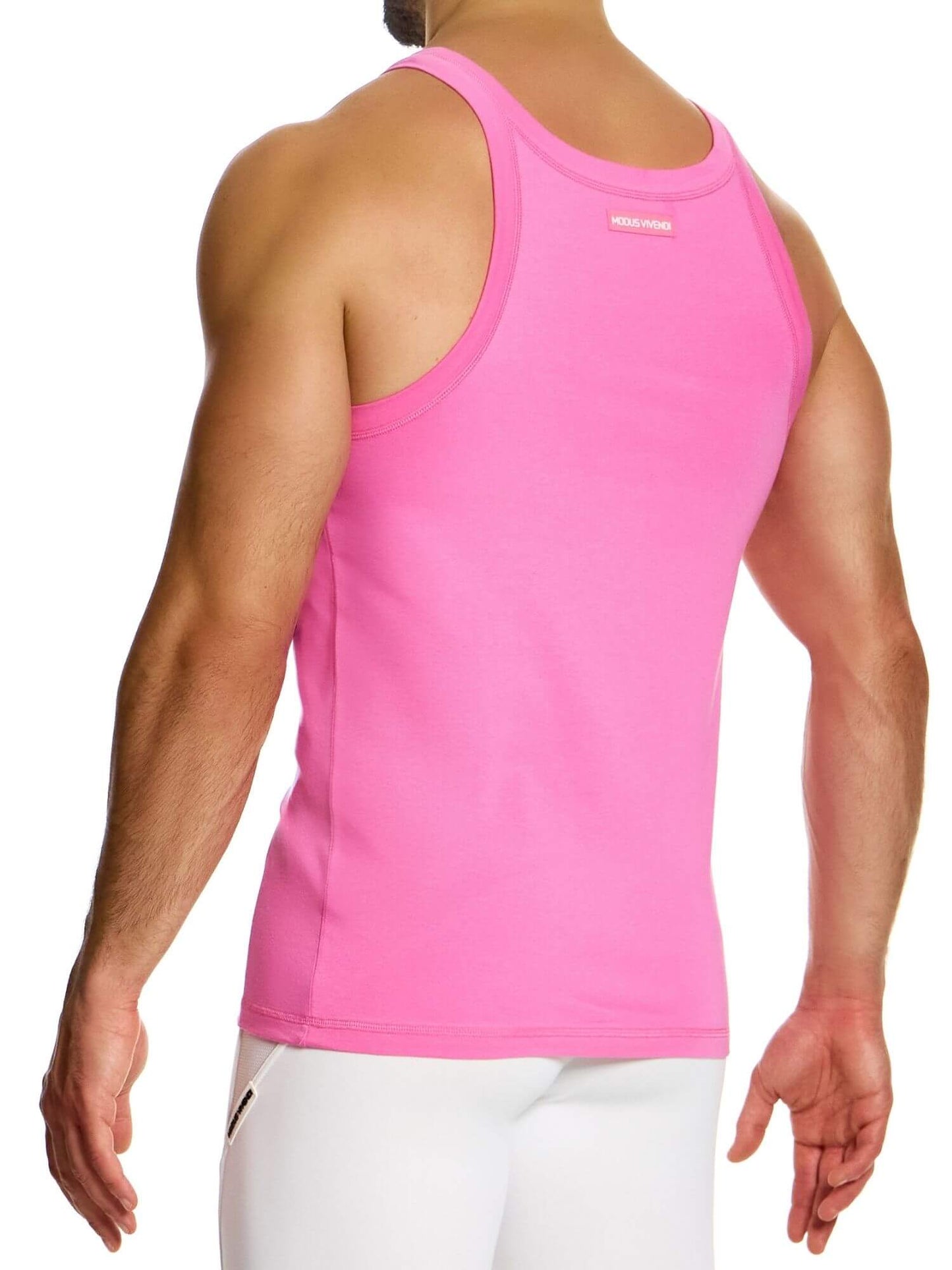 Person wearing a pink tank top on a white background