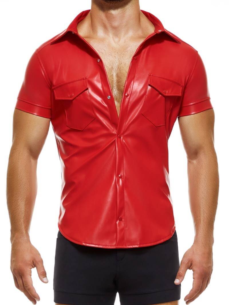 A man wearing a black faux leather short-sleeved collared button-up shirt with a metallic MODUS VIVENDI logo on the back.