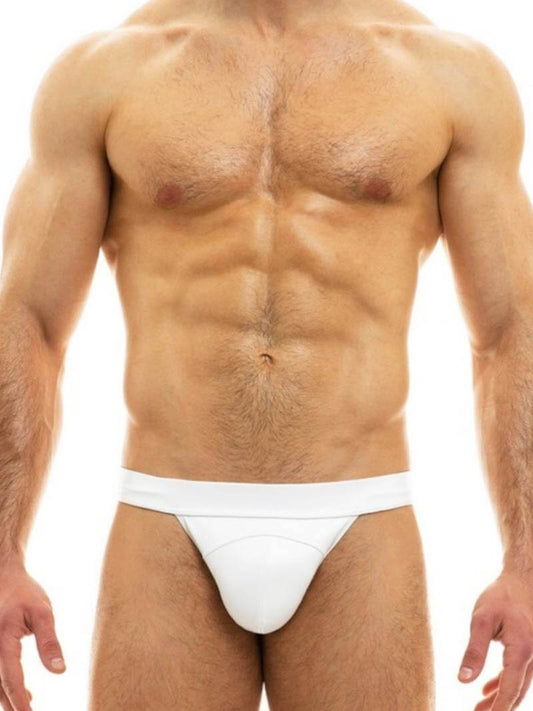This image features the MODUS VIVENDI Leather Tanga, designed with a sleek, fitted look that emphasizes comfort and style. The tanga is crafted from a high-quality polyester material that mimics the appearance and feel of real leather, boasting a colored body with matching stitching and a waistband, accented by a small metallic Modus Vivendi nickel logo.