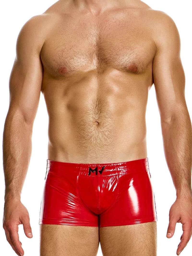 This image displays the MODUS VIVENDI PVC Vinyl Boxer Trunk, worn by a fit male model. The boxer trunk features a high shine, glossy PVC material, reminiscent of latex but made from 100% polyurethane for durability and a super shiny appearance.