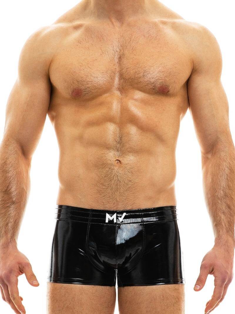 This image displays the MODUS VIVENDI PVC Vinyl Boxer Trunk, worn by a fit male model. The boxer trunk features a high shine, glossy PVC material, reminiscent of latex but made from 100% polyurethane for durability and a super shiny appearance.