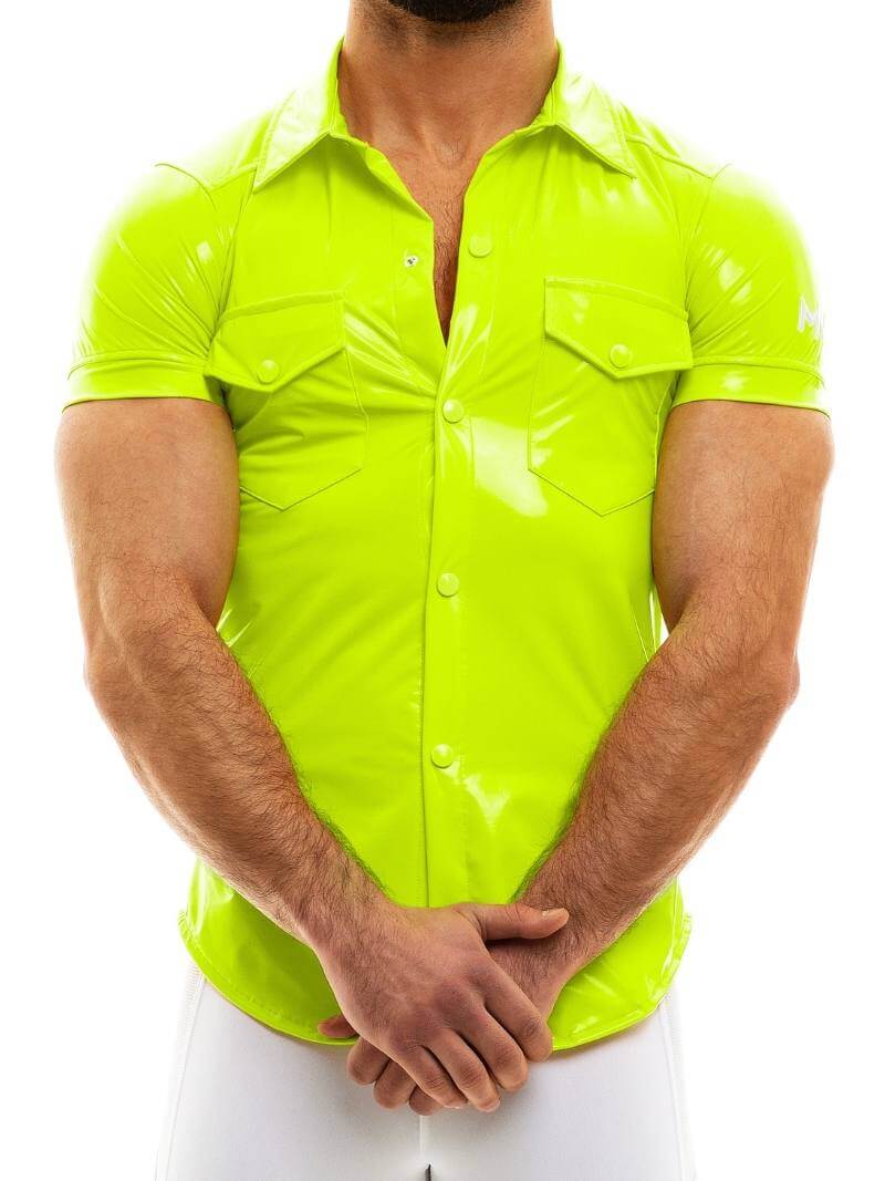 A person wearing a shiny black PVC look shirt with short sleeves, a collar, and front buttons. The shirt has two front buttoned pockets and features an MV logo on the sleeves.