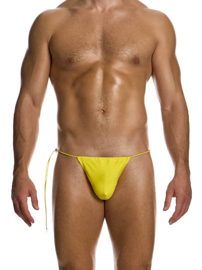 A model wearing a yellow Chameleon Swimwear T-String from the Modus Vivendi collection with side tie strings and a thong piece rear.