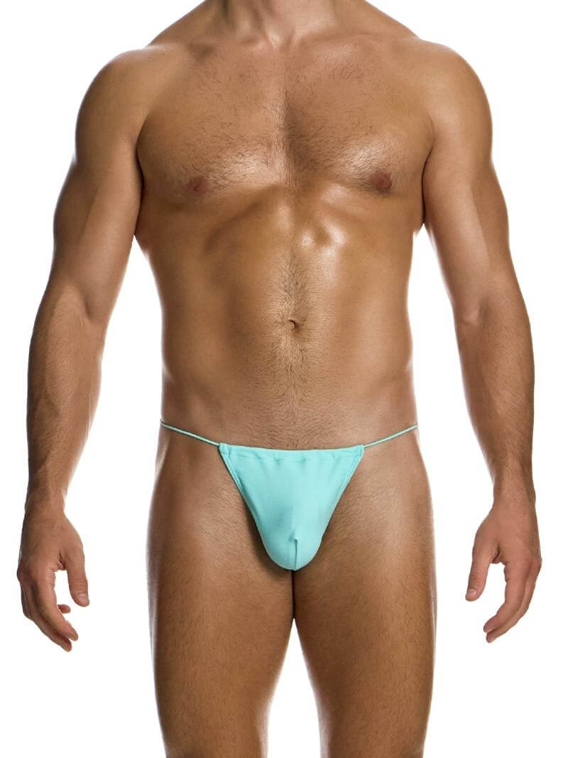 A model wearing a yellow Chameleon Swimwear T-String from the Modus Vivendi collection with side tie strings and a thong piece rear.