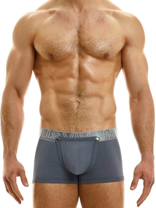 A model wearing a pair of white boxer briefs with a removable pouch and metal stud fastenings, from the Hole collection by Modus Vivendi.