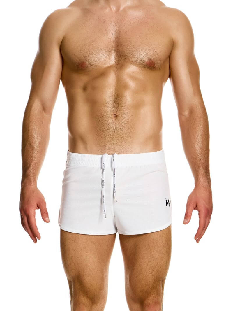 A man wearing blue jogging-style gym shorts with a drawstring waist.