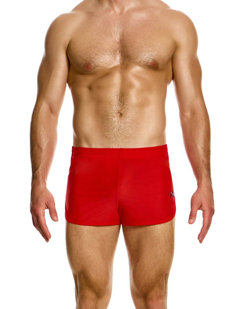 A man wearing blue jogging-style gym shorts with a drawstring waist.