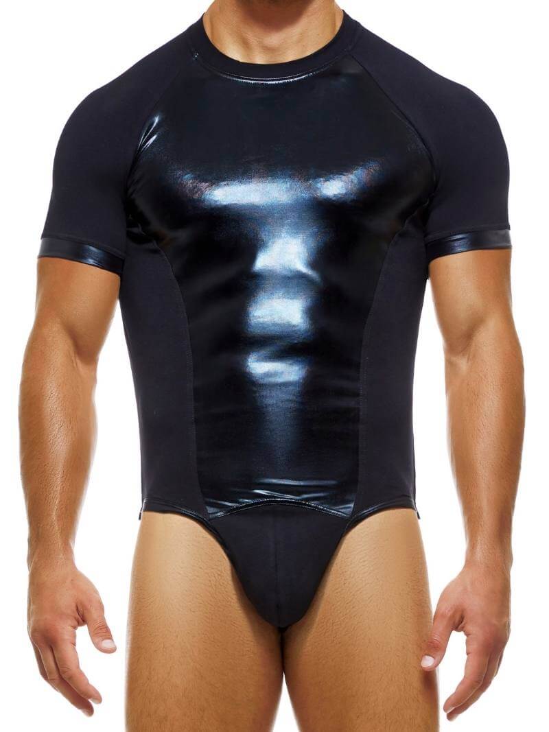 A man wearing a black latex look shiny bodysuit with thong rear and short sleeves. The bodysuit has a shiny finish on the front and matte cotton sleeves and side panels.