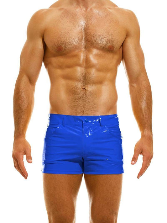 A man wearing red PVC vinyl 5 pocket shorts with a zip-up fly, button fastening, belt loops, and a thermo logo on the back pocket.