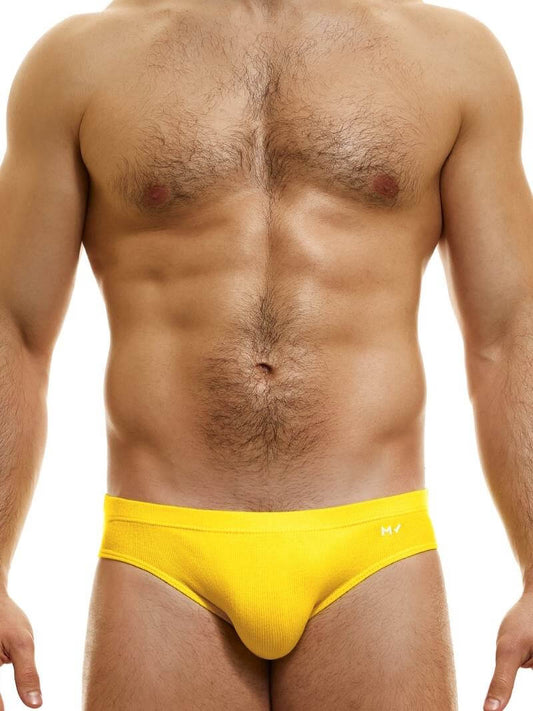 This image displays the MODUS VIVENDI Peace Classic Brief, modeled in a striking neon blue color. The briefs are designed with a low-rise waistband that ensures a modern and comfortable fit.