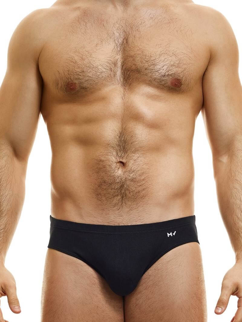 This image displays the MODUS VIVENDI Peace Classic Brief, modeled in a striking neon blue color. The briefs are designed with a low-rise waistband that ensures a modern and comfortable fit.