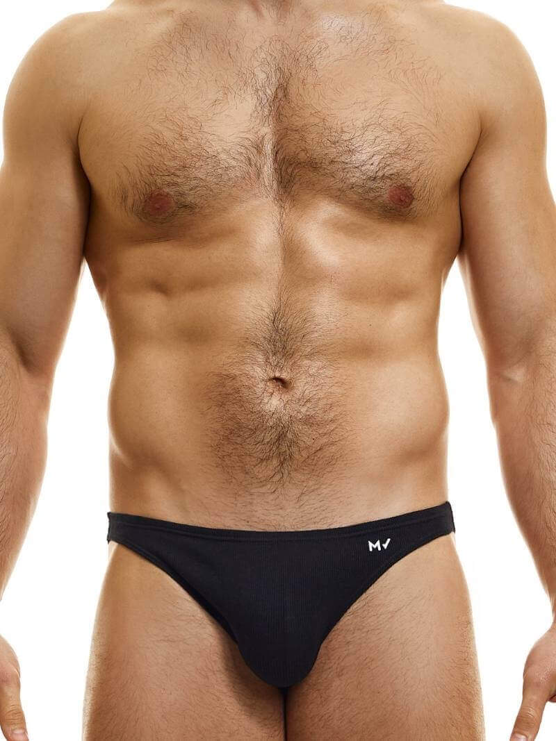 This image features the MODUS VIVENDI Peace low-cut mini brief, showcased in a striking neon blue color. The brief is designed with a super low-rise elastic waist and high-cut legs, creating a modern and flattering silhouette.
