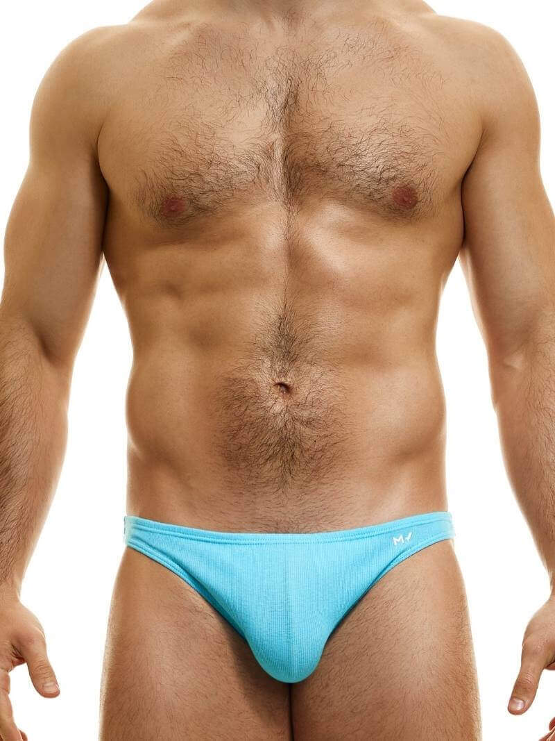 This image features the MODUS VIVENDI Peace low-cut mini brief, showcased in a striking neon blue color. The brief is designed with a super low-rise elastic waist and high-cut legs, creating a modern and flattering silhouette.