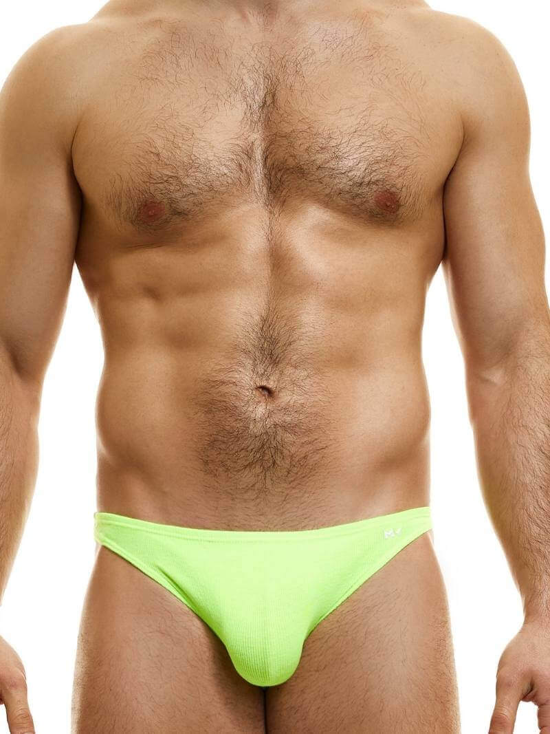 This image features the MODUS VIVENDI Peace low-cut mini brief, showcased in a striking neon blue color. The brief is designed with a super low-rise elastic waist and high-cut legs, creating a modern and flattering silhouette.