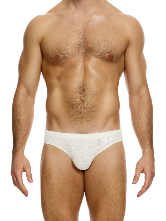 A male model wearing a light blue knitted brief with a small MV logo on the waistband, made by Modus Vivendi.