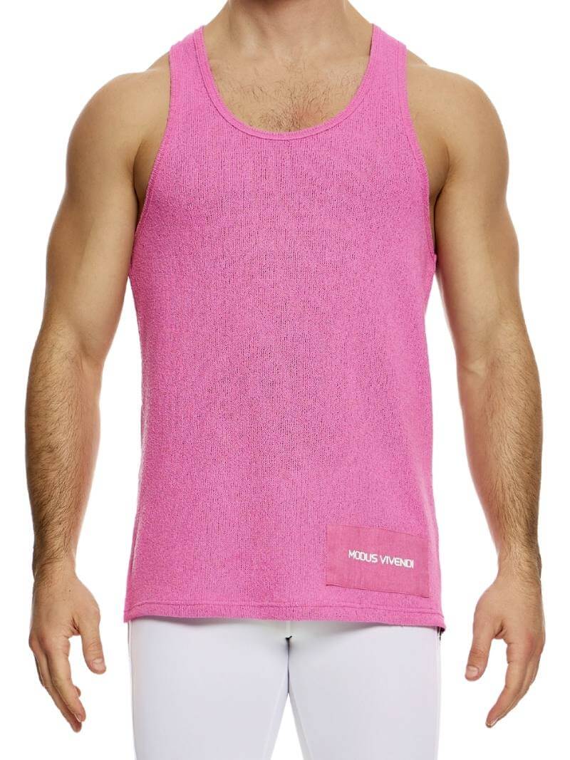 A male model wearing a long-length, round scoop neck, racer back, and straight fit pink knitted tank top with a linen panel on the back.