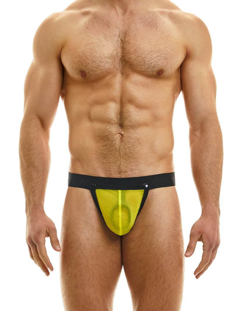 A model wearing a MODUS VIVENDI men's mesh pleasure thong, which is see-through with a black waistband and detachable pouch c-ring.