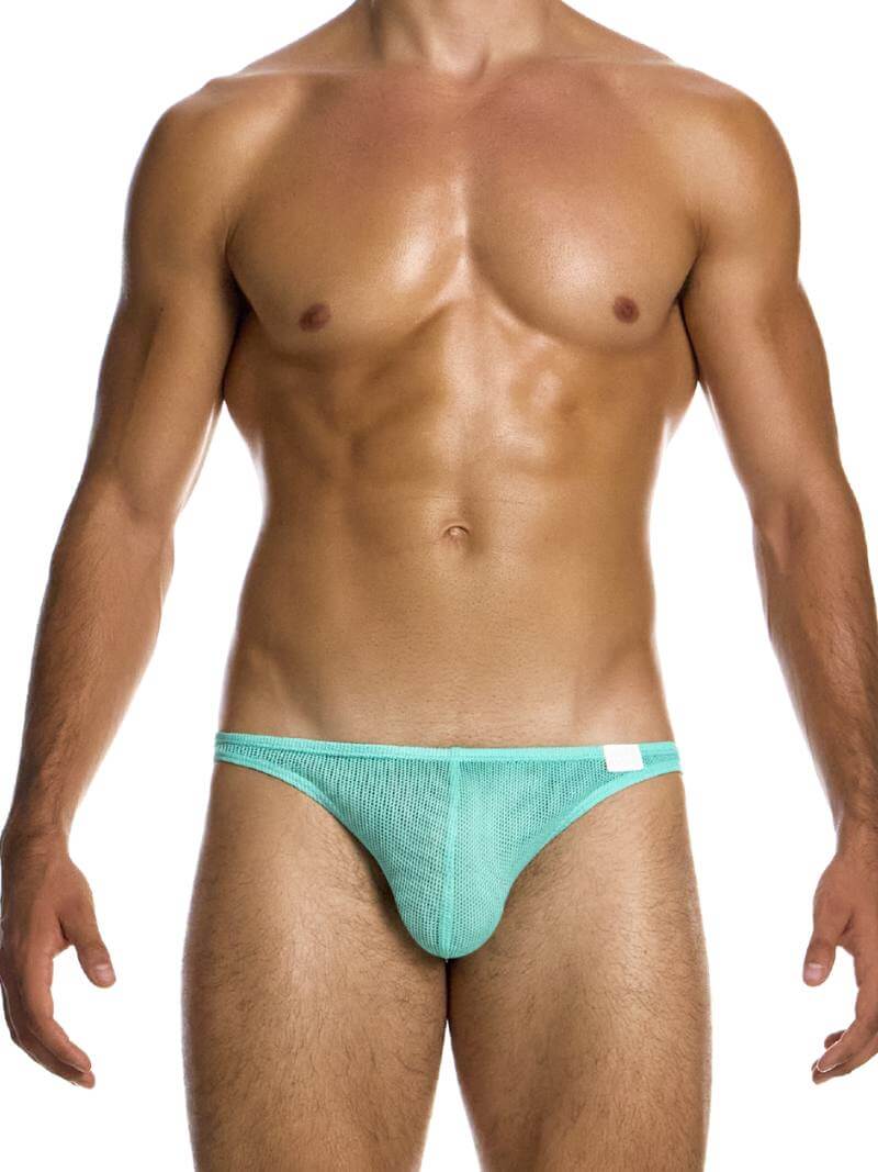 A man wearing a bold pink low cut bikini brief with a contoured pouch.