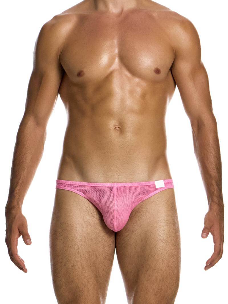 A man wearing a bold pink low cut bikini brief with a contoured pouch.