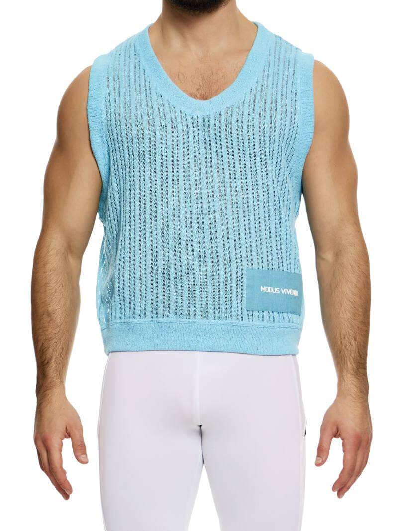A male model wearing a light-colored, scoop neck, striped knit crochet tank top with a linen placket featuring the Modus Vivendi branding.