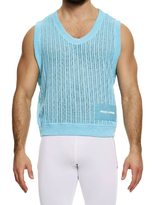 A male model wearing a light-colored, scoop neck, striped knit crochet tank top with a linen placket featuring the Modus Vivendi branding.