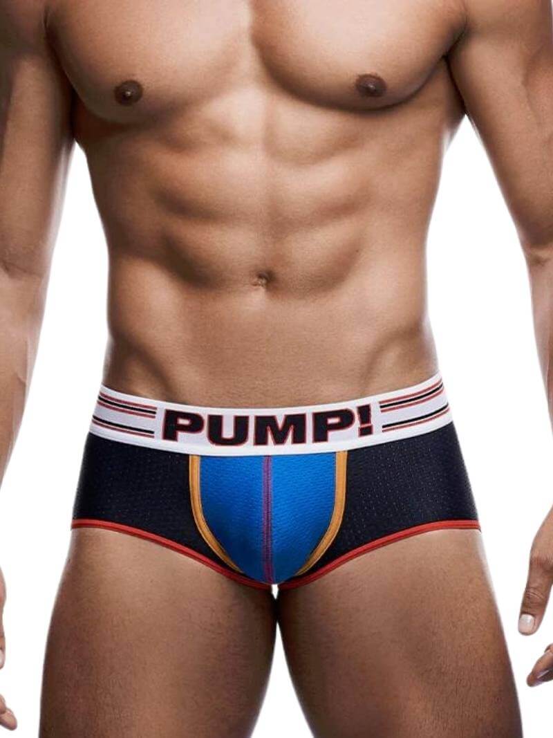 A model wearing PUMP Underwear Circuit Backless Underwear Trunk with black and blue color scheme, featuring a contoured pouch and a wide elastic waistband with PUMP branding.