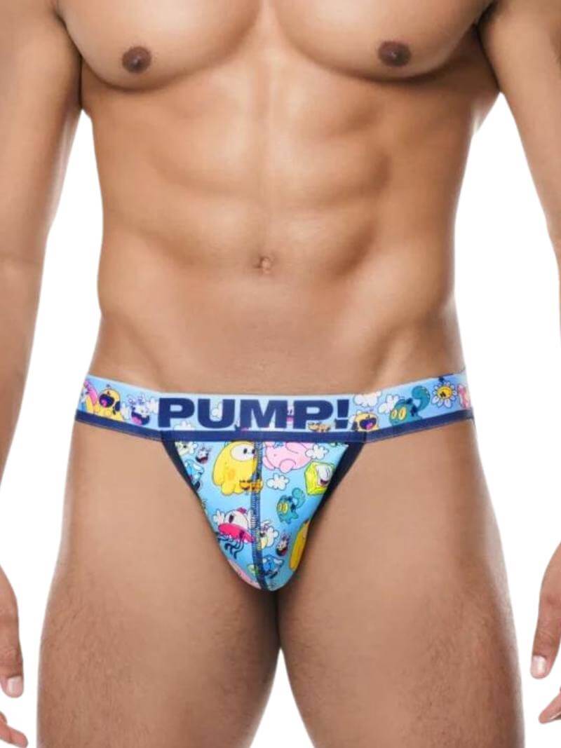 This image features the PUMP Underwear Funtopia Jockstrap, designed with a playful and colorful cartoon print on a light-blue background. The jockstrap, which has a 40mm elastic waist, showcases a navy blue PUMP! branded waistband.