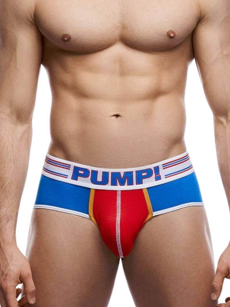 A model wearing PUMP Underwear Velocity Brief with contrasting blue and red design on the body, and a striped waistband with PUMP! branding.