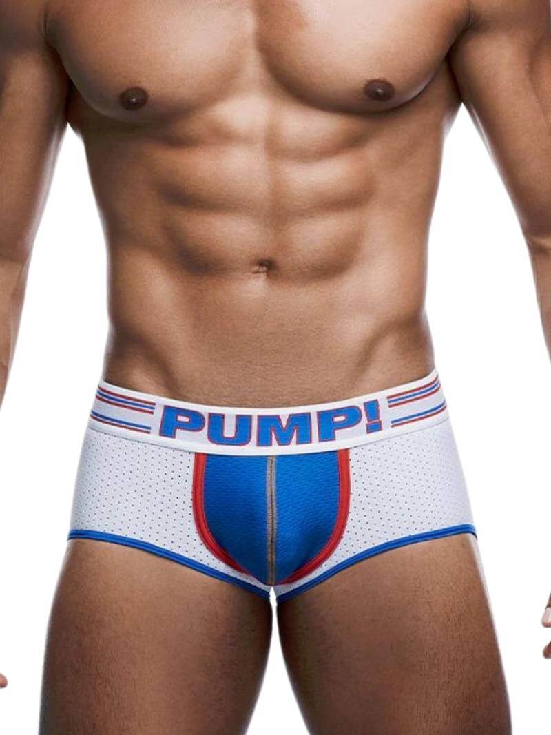 This image features the PUMP Underwear Velocity Bottomless Underwear Trunk, a bold and athletic piece designed for an active lifestyle. The model is shown wearing the trunk, which is predominantly white with electric blue and red detailing.