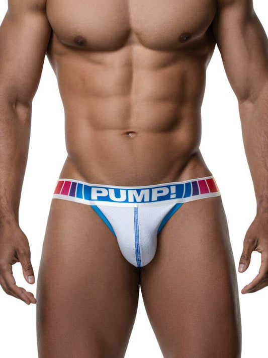 Man wearing a white jockstrap with 'PUMP!' branding on a plain background