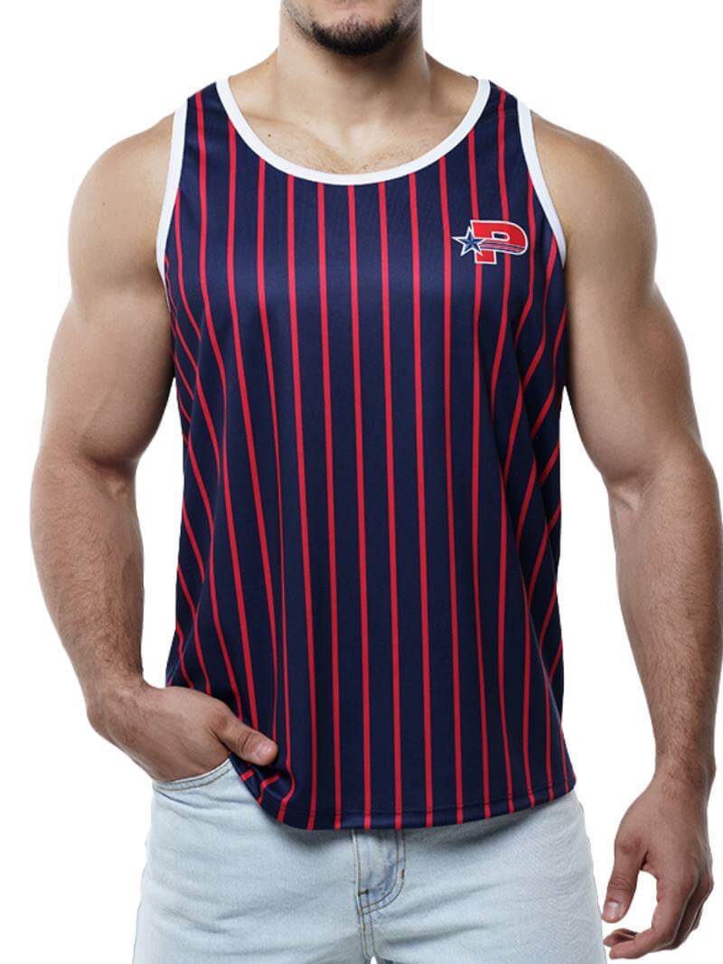 A man wearing a navy striped tank top with red stripes and a PUMP branded patch on the chest, paired with blue jeans.