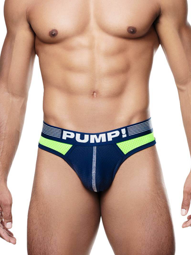 This image features the PUMP Underwear Surge Thong, designed for both sporty and casual wear. The thong has a striking navy and neon green color scheme with contrasting thick piping and stitching details that enhance its sporty look.