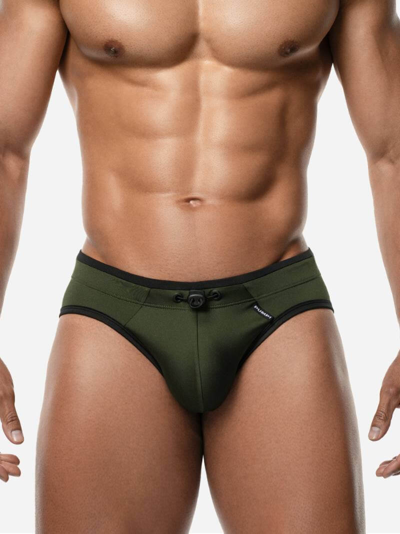 Man wearing green underwear on a white background