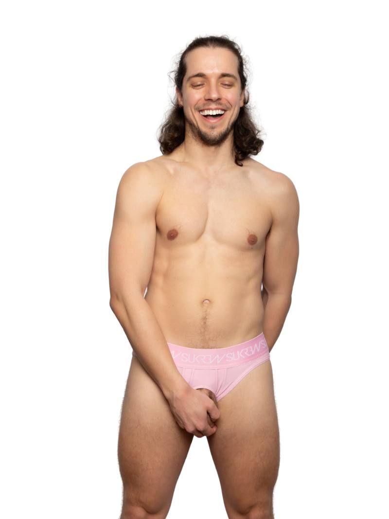 Man wearing pink underwear on a white background