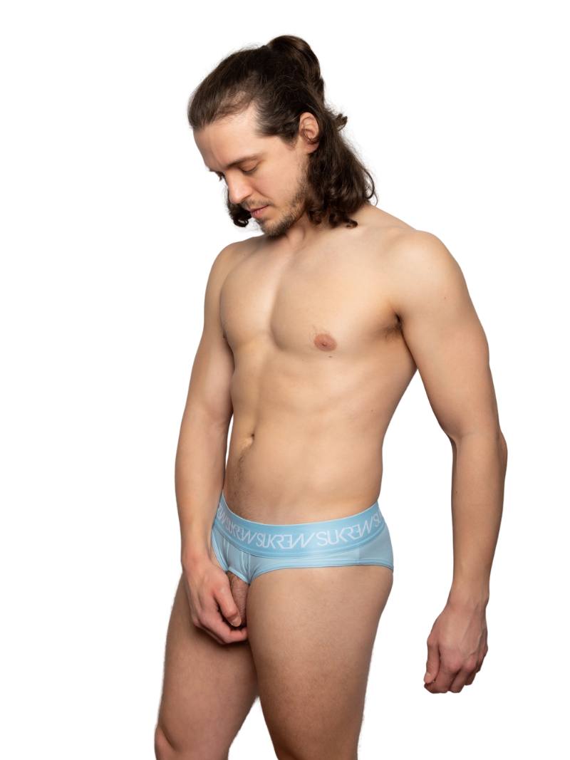 Man wearing a light blue underwear on a white background