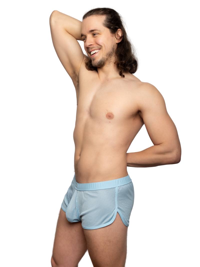 Man wearing light blue underwear on a white background