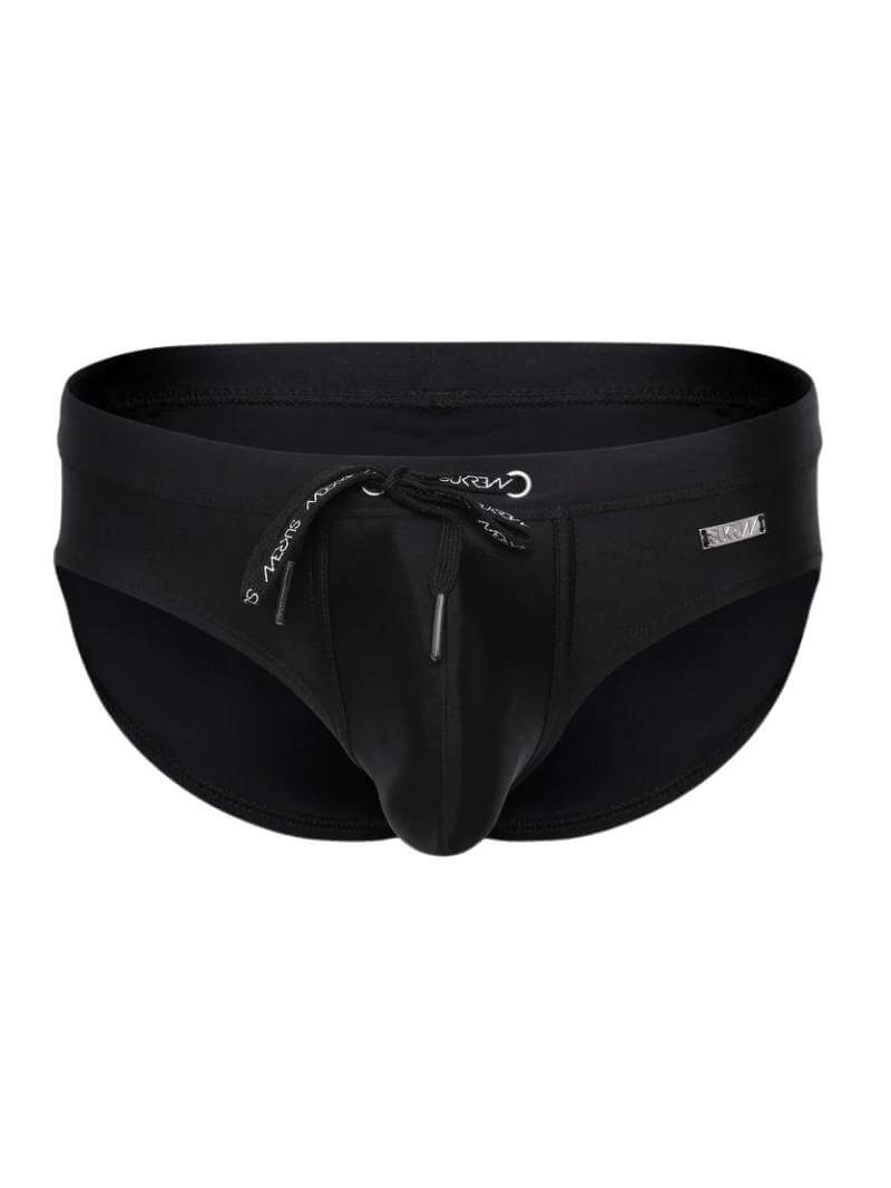 A black SUKREW Torrent swimming brief with a contoured pouch, elastic waistband, and drawstrings.