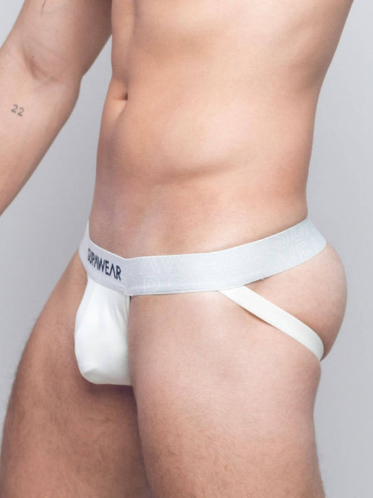 A close-up of a male model wearing white jockstrap underwear, showing the waistband with the brand name and the pouch.
