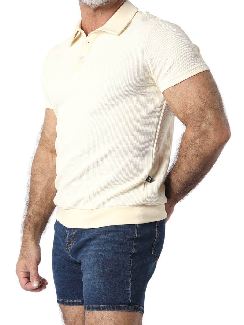 Close-up of a beige textured polo shirt on a person