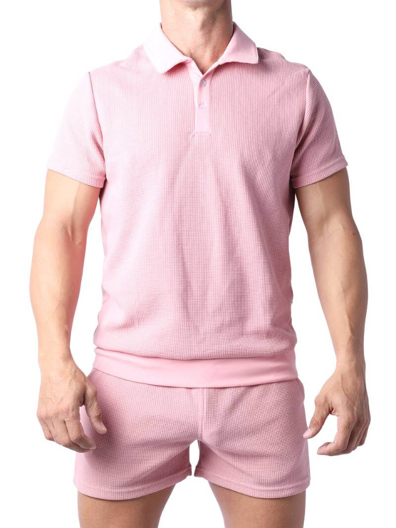 Close-up of a pink checkered garment with a focus on texture and pattern.